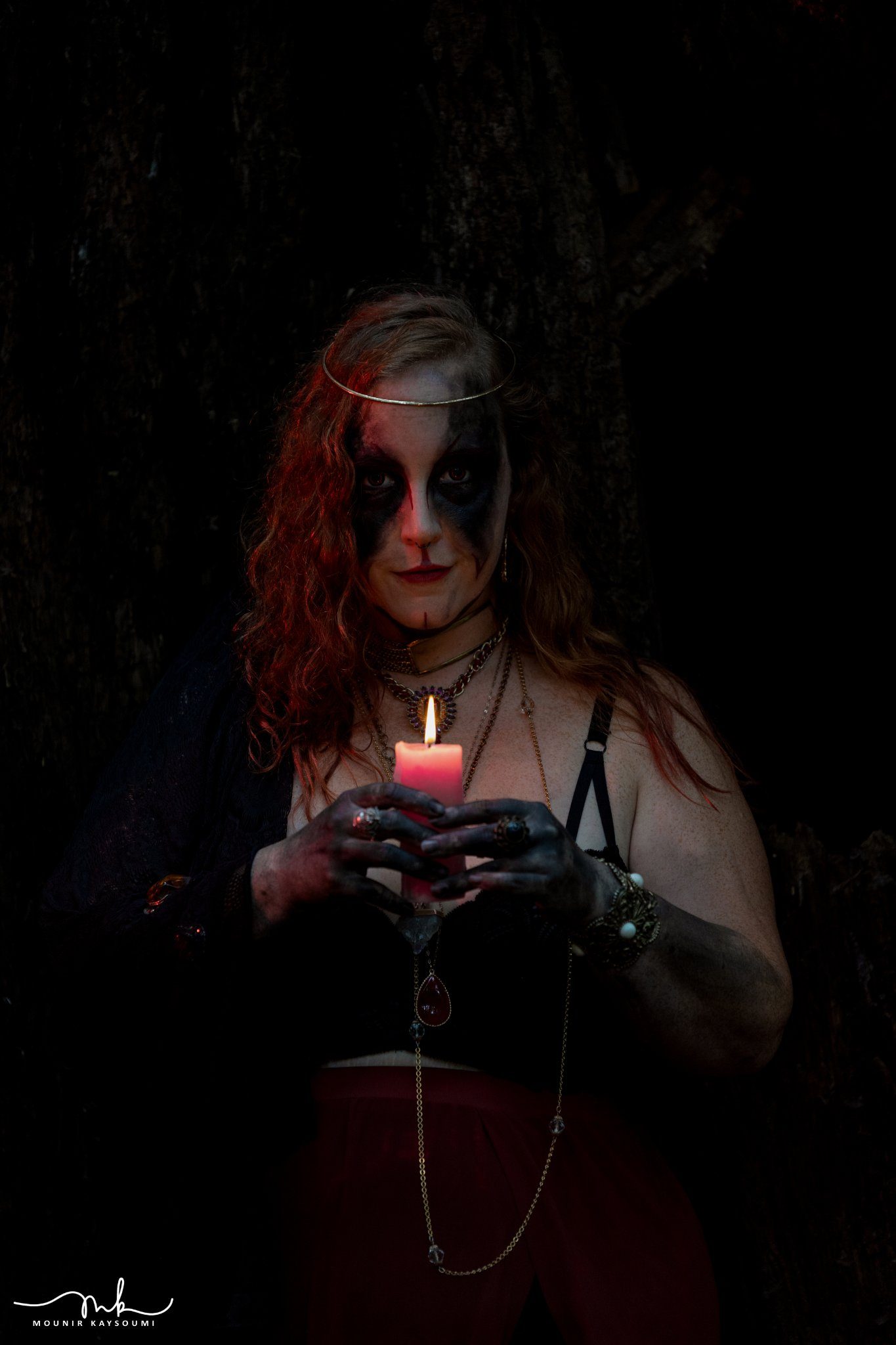Woman with candle in the dark