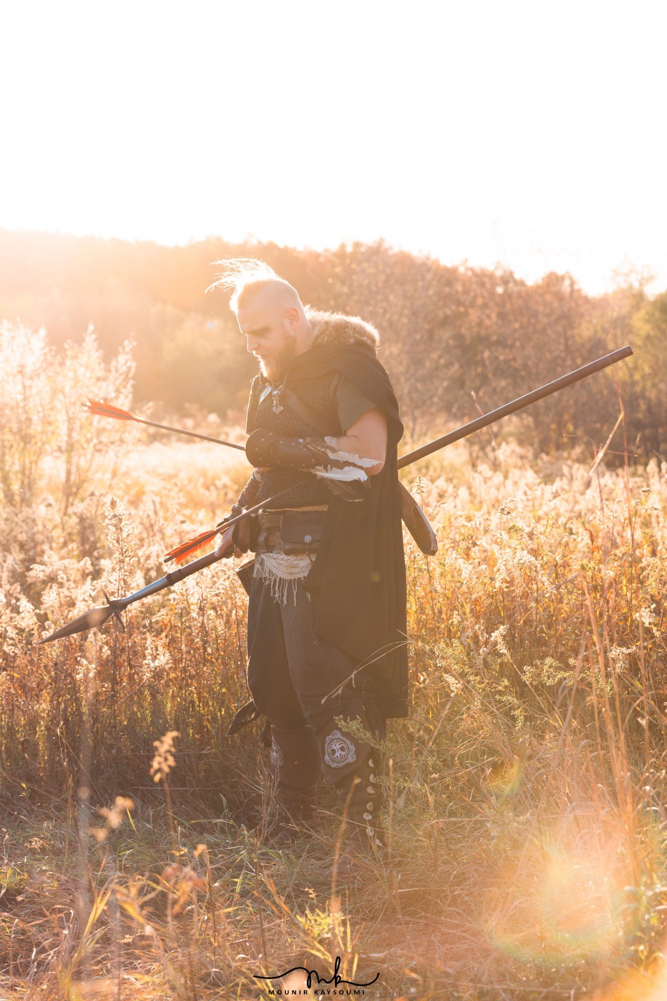 Warrior with scythe at sunset