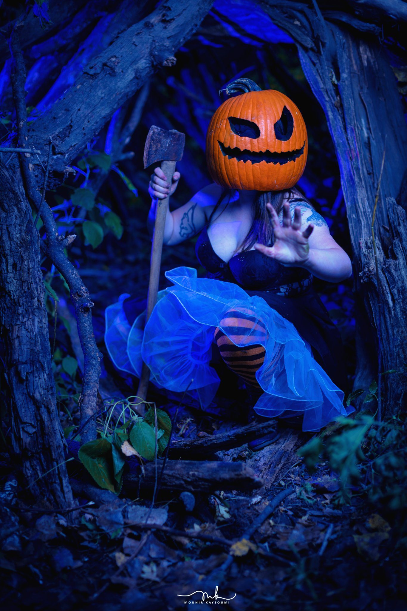 Pumpkin-headed figure at night
